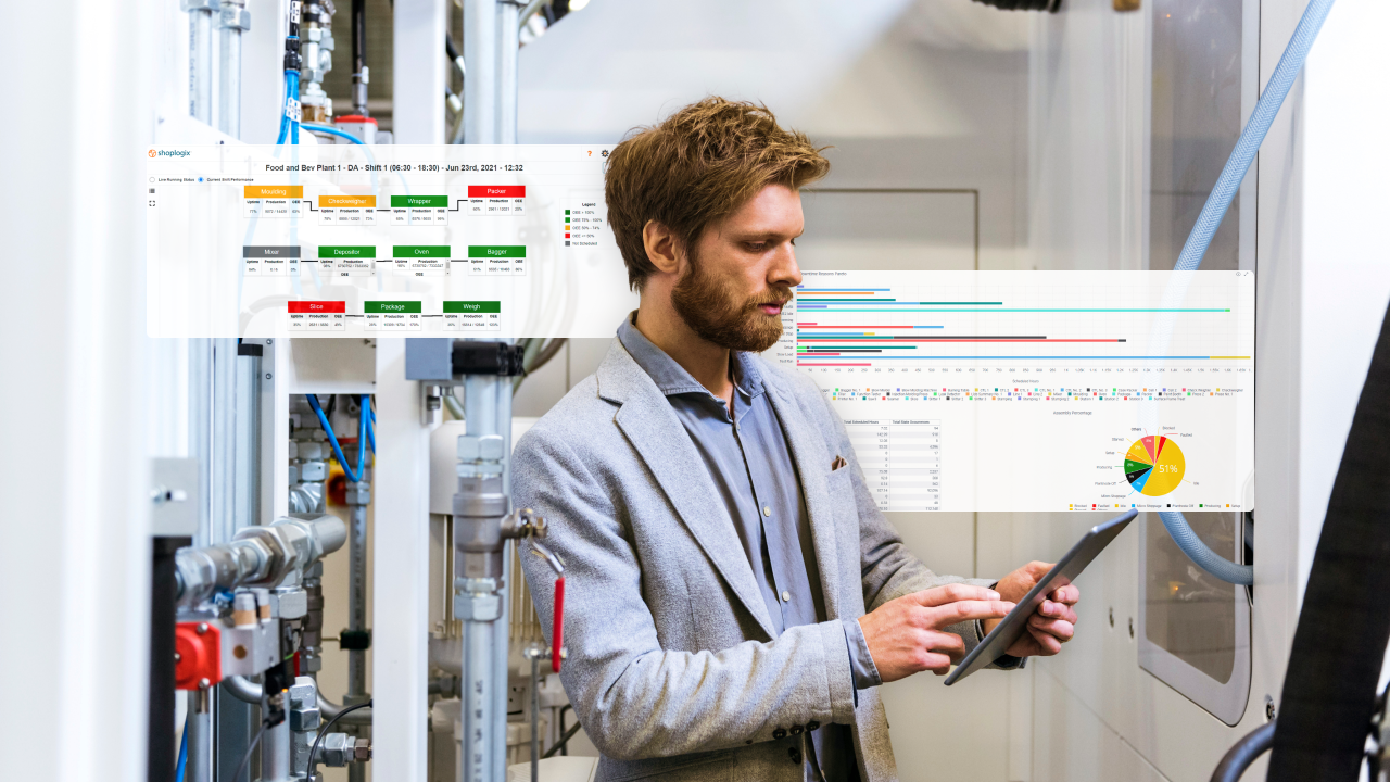 A man in casual work attire attentively reviewing data on a tablet, standing in a technical room.