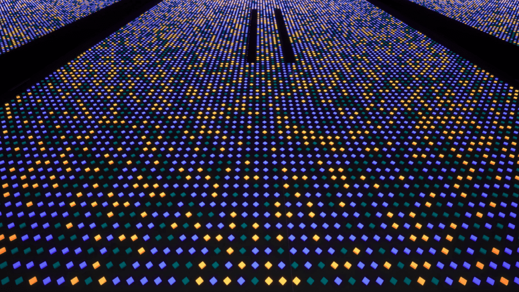 a wall of green, yellow and purple pin lights
in quantum materials in manufacturing